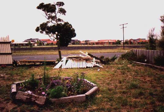 View from front window of damaged fence.
